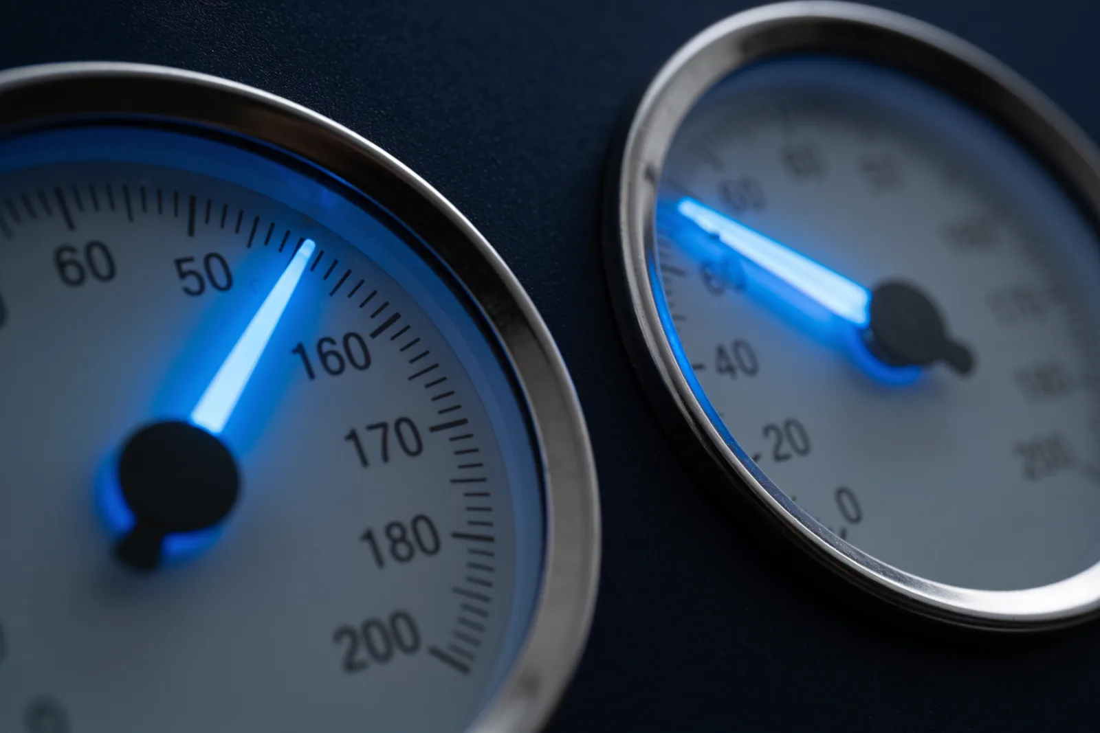 Two identical measuring dials with needles resting at different positions